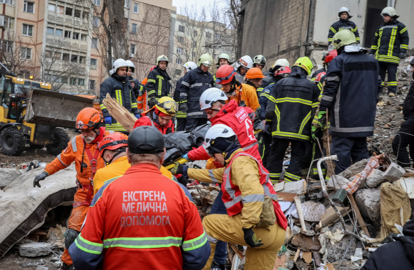  Rescuers remove the body of a local resident at the site of a residential building heavily damaged by a Russian drone strike, amid Russia's attack on Ukraine, in Odesa, Ukraine March 2, 2024. (credit: REUTERS/STRINGER)