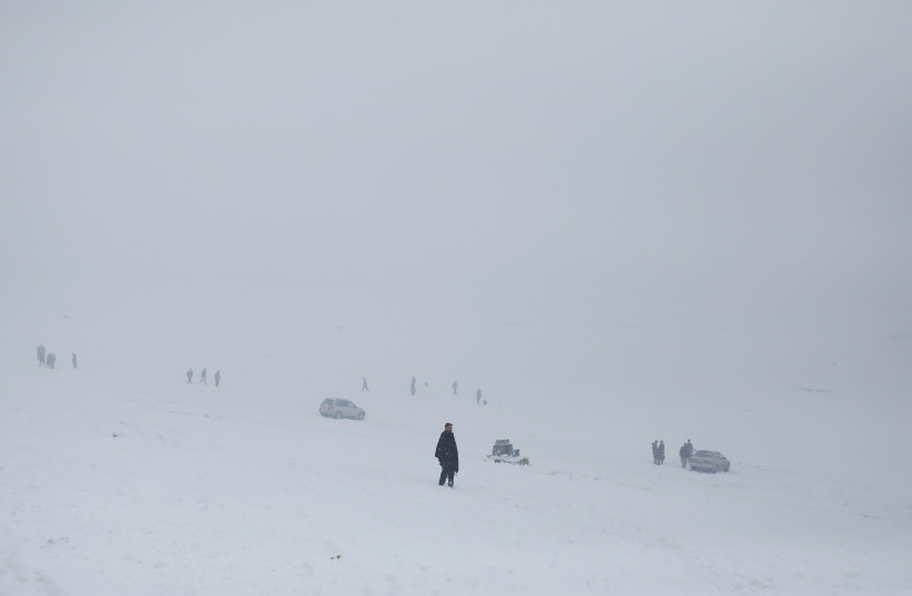  A general view of people on a snow-covered ground in Kabul, Afghanistan, January 29, 2023. (credit:  REUTERS/ALI KHARA)