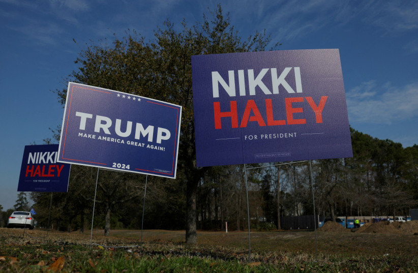  Campaign signs for Republican presidential candidates former U.S. Ambassador to the United Nations Nikki Haley and former U.S. President Donald Trump stand along an intersection in Mount Pleasant, South Carolina, U.S., February 22, 2024. (credit: BRIAN SNYDER/REUTERS)