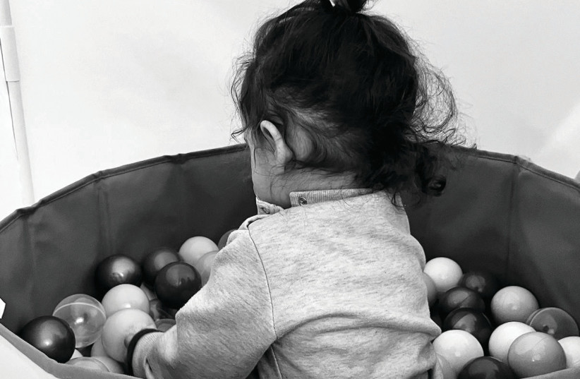  MAYA PLAYS in her ball pit. (credit: COURTESY THE FAMILY)