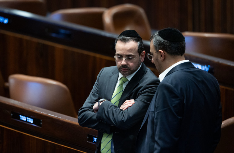 Minister of Health Uriel Buso speaks with MK Yoni Mashriki discussion and a vote on the state budget at the assembly hall of the Israeli parliament in Jerusalem, February 7, 2024. (credit: YONATAN SINDEL/FLASH90)