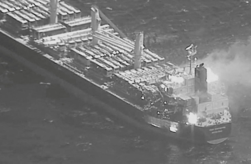  An aerial view of the Barbados-flagged ship True Confidence ablaze following a Houthi missile attack at sea, March 6, 2024, in this handout photo.  (credit:  DVIDS/Handout via REUTERS )