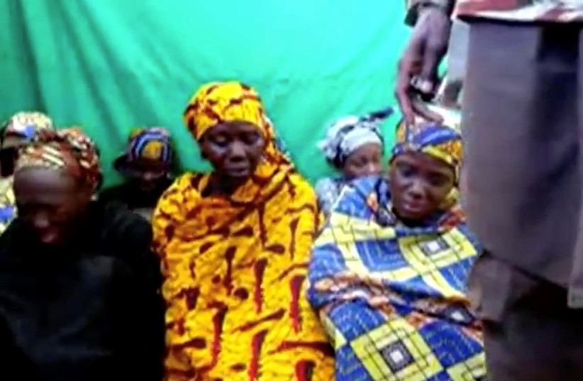  Remaining girls who were kidnapped from the northeast Nigerian town of Chibok are seen in an unknown location in Nigeria in this still image taken from an undated video obtained on January 15, 2018.  (credit: BOKO HARAM HANDOUT/SAHARA REPORTERS VIA REUTERS)