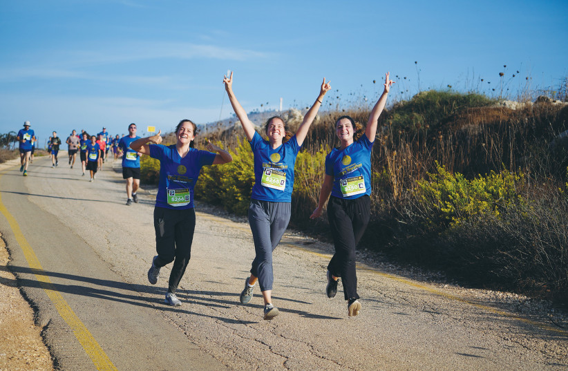 RUNNERS PARTICIPATE in the International Bible Marathon, in Samaria, in 2019. Judea and Samaria is the historic heartland of the Jewish people’s ancestral homeland, and Jews have lived there continuously for millennia, the writer asserts.  (credit: HILLEL MAEIR/FLASH90)