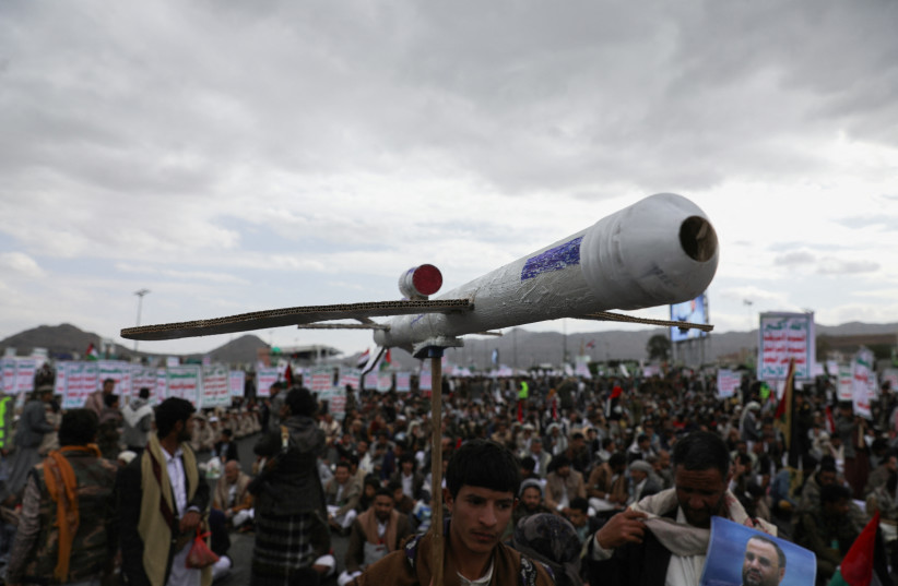 A protester carries a mock drone as demonstrators, predominantly Houthi supporters, rally to show support to the Palestinians in the Gaza Strip, amid the ongoing conflict between Israel and the Palestinian Islamist group Hamas, in Sanaa, Yemen February 16, 2024.  (credit: KHALED ABDULLAH/REUTERS)