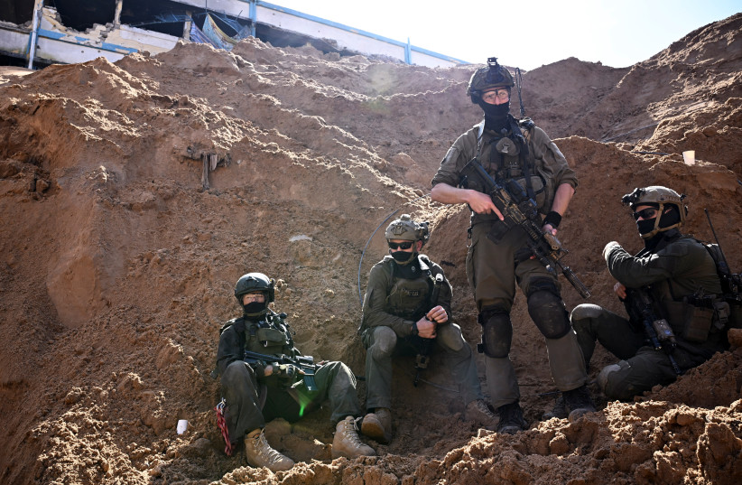 Israeli soldiers operate near what the military described as a Hamas command tunnel running partly under UNRWA headquarters, amid the ongoing conflict between Israel and the Palestinian Islamist group Hamas, in the Gaza Strip, February 8, 2024. (credit: DYLAN MARTINEZ/REUTERS)