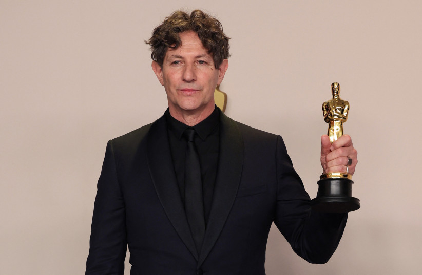  Director Jonathan Glazer poses with the Oscar for Best International Feature Film for ''The Zone of Interest'' of United Kingdom in the Oscars photo room at the 96th Academy Awards in Hollywood, Los Angeles, California, U.S., March 10, 2024.  (credit: Carlos Barria/Reuters)