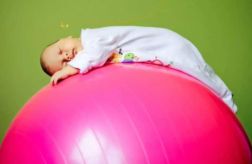   There's nothing like gentle bouncing on the ball to calm a gassy baby (credit: SHUTTERSTOCK)