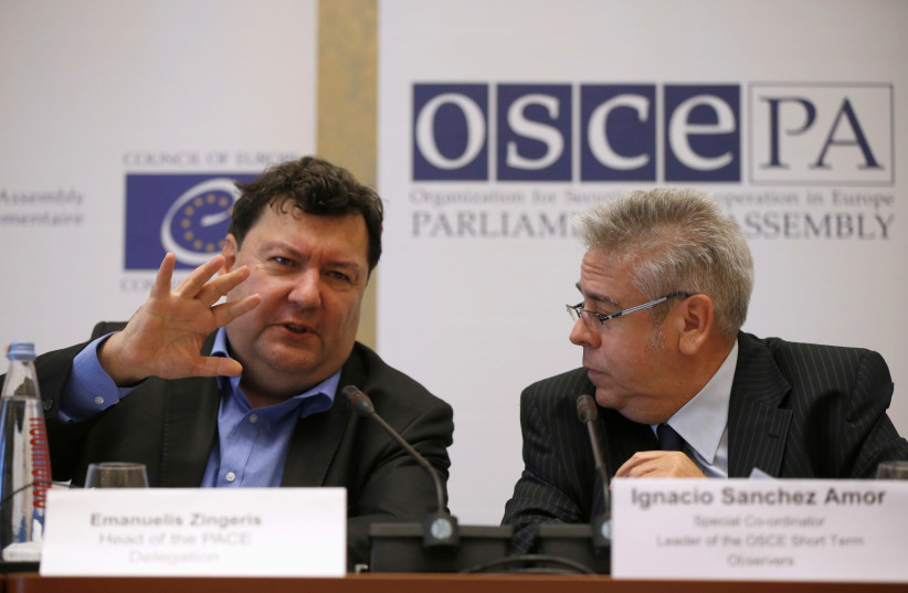  Ignacio Sanchez Amor (R), a leader of the OSCE Short Term Observers, listens to Emanuelis Zingeris, a head of PACE Delegation during a news conference after the parliamentary election in Tbilisi, Georgia, October 9, 2016.  (credit: DAVID MDZINARISHVILI/REUTERS)