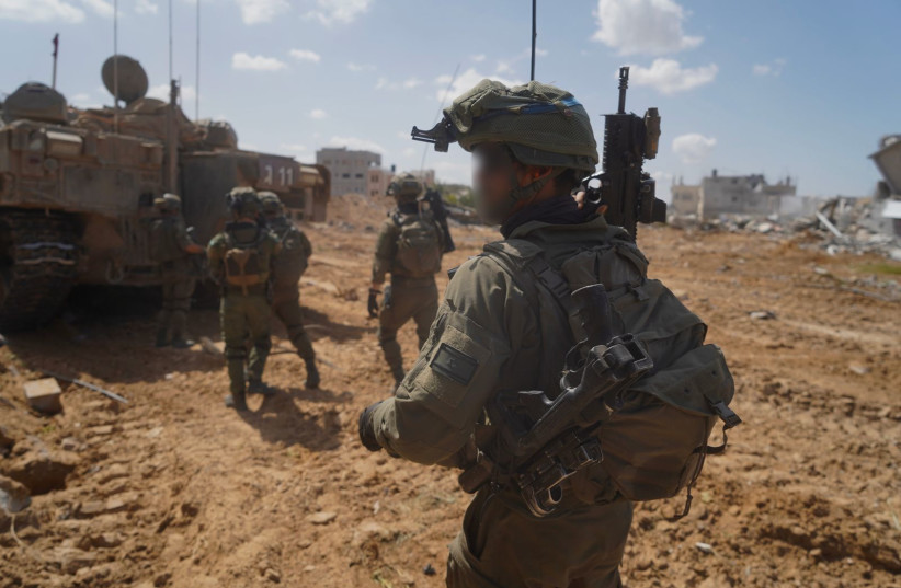IDF soldiers operate in the Hamad neighborhood of Khan Yunis, in Gaza, March 13, 2024 (credit: SETH J. FRANTZMAN)