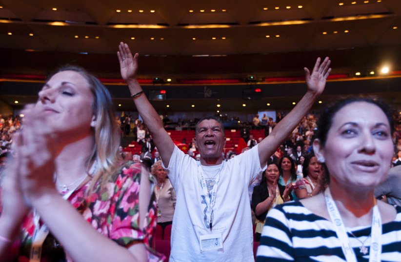  Evangelical Christians from around the world sing and recite prayers as they attend the 2013 Jerusalem Chairman's Conference hosted by the Israel Allies Foundation, at the International Convention Center in Jerusalem, on September 22, 2013. (credit: FLASH90)