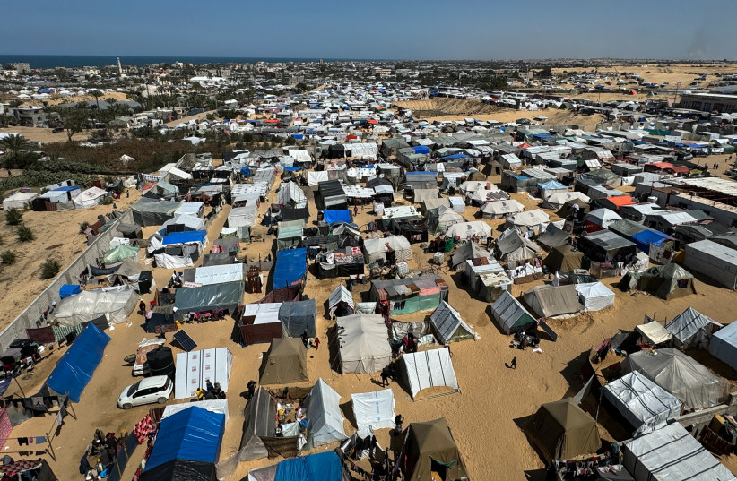 Displaced Palestinians, who fled their houses due to Israeli strikes, shelter in a tent camp, amid the ongoing conflict between Israel and the Palestinian Islamist group Hamas, in Rafah, in the southern Gaza Strip March 11, 2024.
