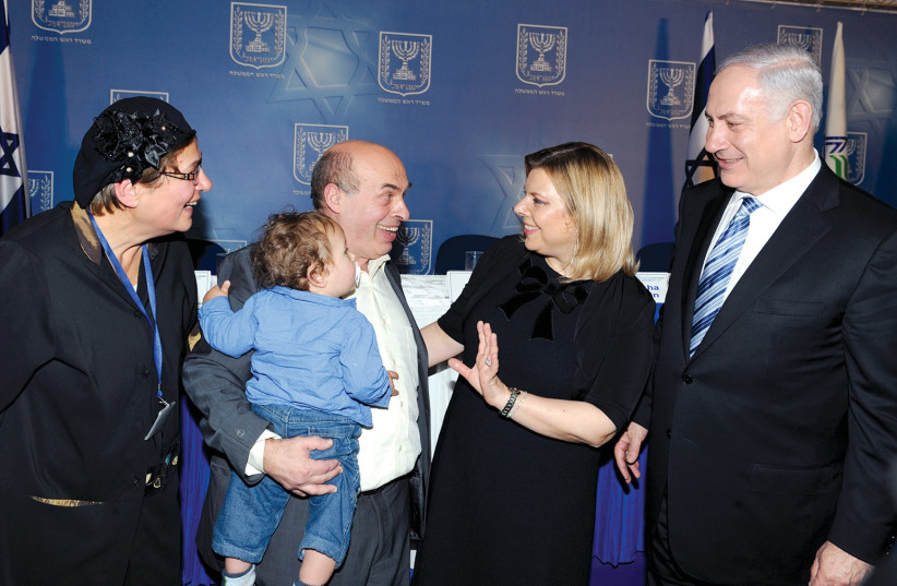  Natan Sharansky is seen greeting Prime Minister Benjamin Netanyahu and wife, Sara, at a party celebrating the 25th anniversary of Sharansky’s liberation, Feb. 2011. (credit: Moshe Milner/GPO)