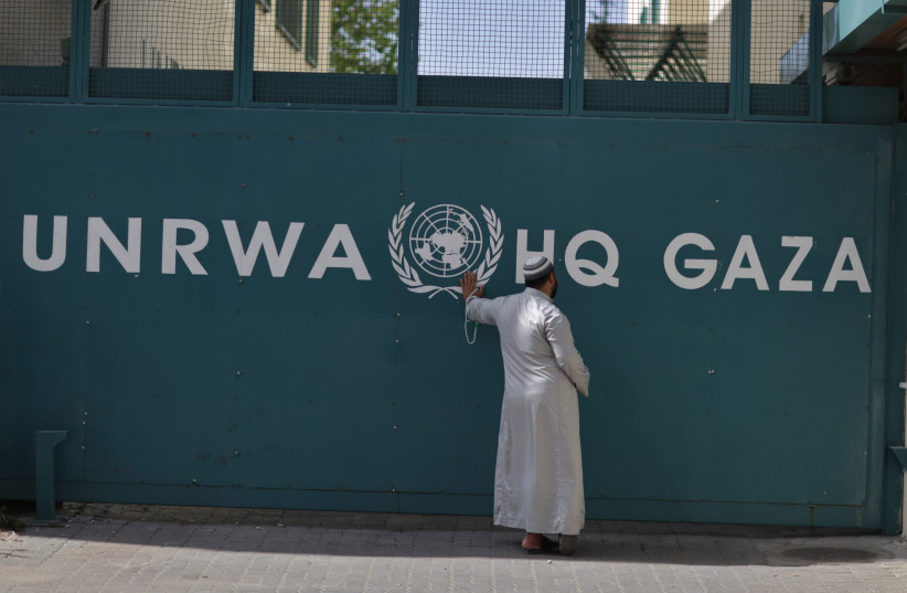  A Palestinian man waits outside of the UNRWA headquarters building in Gaza City on April 6, 2013. (credit: Wissam Nassar/Flash90.)