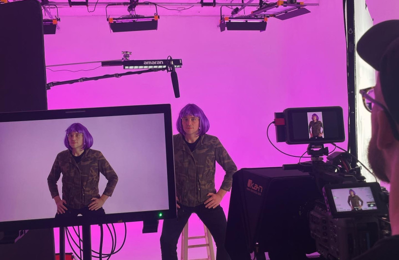 SPAULDING FILMING one of his purple-hair girl videos.  (credit: Daniel-Ryan Spaulding)