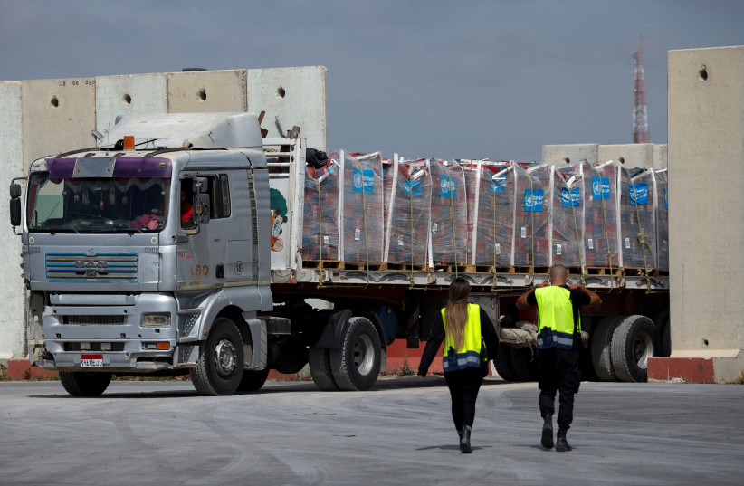  A truck carrying humanitarian aid bound for the Gaza Strip drives at the inspection area at the Kerem Shalom crossing, amid the ongoing conflict between Israel and the Palestinian Islamist group Hamas, in southern Israel, March 14, 2024.  (credit: REUTERS/Carlos Garcia Rawlins TPX IMAGES OF THE DAY)