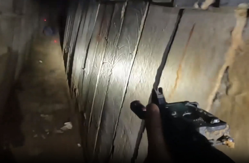  POV camera footage of an IDF solider running through the long tunnel in the northern Gaza Strip, March 17, 2024. (credit: IDF SPOKESPERSON'S UNIT)