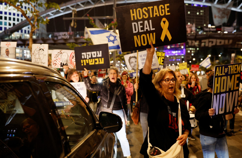  Demonstrators take part in a protest calling for the release of hostages, in Tel Aviv (credit: REUTERS/CARLOS GARCIA RAWLINS)
