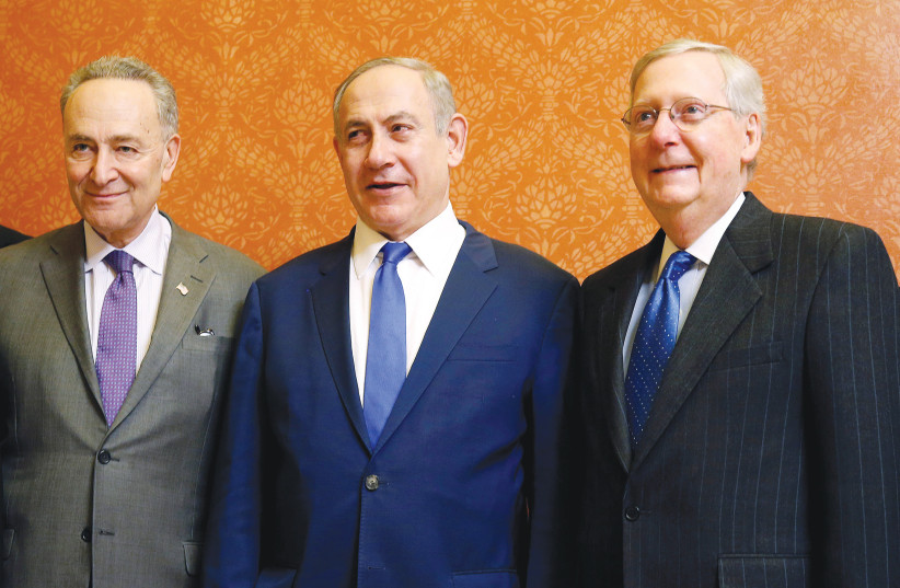  PRIME MINISTER Benjamin Netanyahu is flanked by then-Senate minority leader Chuck Schumer (left) and then-Senate majority leader Mitch McConnell, at the US Capitol in 2017. (credit: JOSHUA ROBERTS/REUTERS)