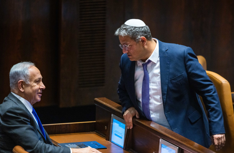  Likud leader MK Benjamin Netanyahu with Head of the Otzma Yehudit party MK Itamar Ben Gvir at a vote in the assembly hall of the Knesset, the Israeli parliament in Jerusalem, on December 28, 2022. (credit: OLIVIER FITOUSSI/FLASH90)