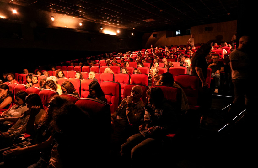  People in a movie theatre wait for the screening of the film 'The Boy' created by Yahav Winner, who was killed following the deadly October 7 attack by Hamas gunmen from the Gaza Strip, on November 11, 2023. (credit: REUTERS/Joseph Campbell)