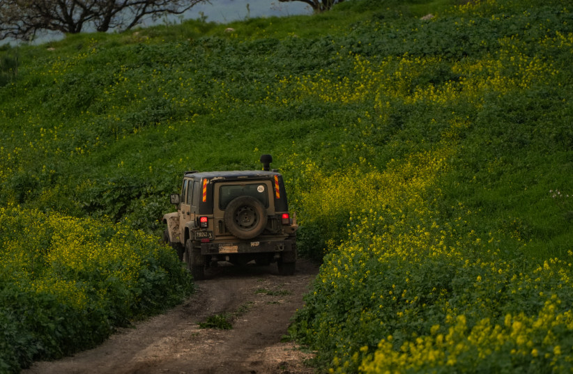  An Israeli military jeep patrols near the Israeli border with Lebanon, northern Israel, February 26, 2024.  (credit: AYAL MARGOLIN/FLASH90)