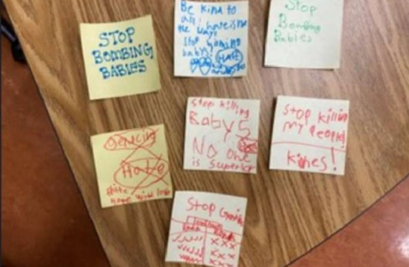  ''Messages of hate'' sticky-notes stuck to the teacher's door. (credit: ANTI-DEFAMATION LEAGUE)