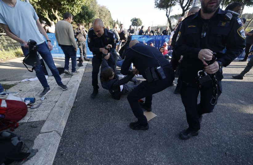 Israel Police officers seen handling protesters near the Knesset, in Jerusalem, on March 20, 2024 (credit: MARC ISRAEL SELLEM)