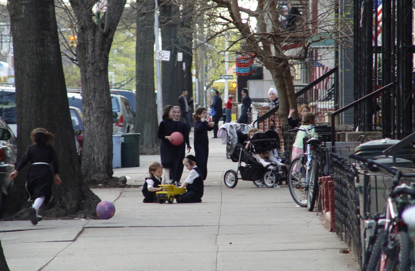  Hasidic children play on the street in Borough Park, Brooklyn. (credit: Lord Ice / CC 3.0 / https://creativecommons.org/licenses/by-sa/3.0/deed.en)