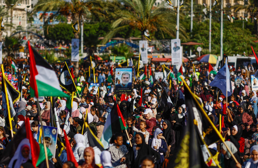  Palestinian Islamic Jihad supporters participate in an anti-Israel rally marking the 36th anniversary of the movement's foundation in Gaza City, October 6, 2023.  (credit: MOHAMMED SALEM/REUTERS)
