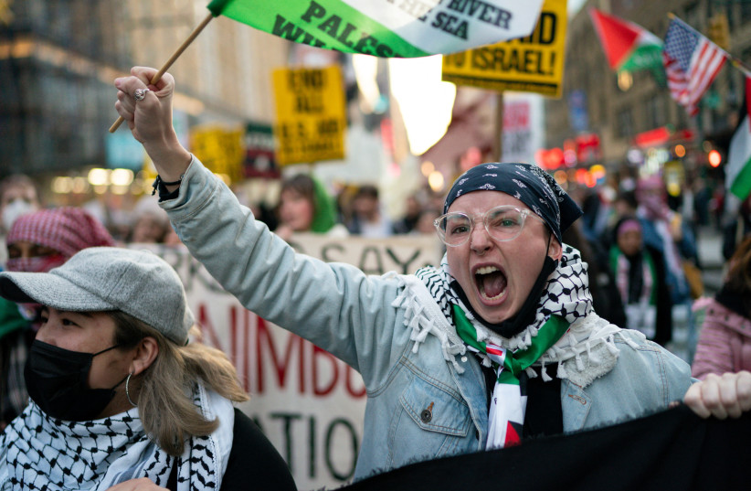  PRO-PALESTINIAN demonstrators shout slogans as they march in the ‘Shut It Down for Palestine’ protests in New York City, last December.  (credit: Eduardo Munoz/Reuters)
