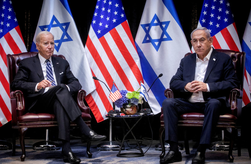  U.S. President Joe Biden, left, pauses during a meeting with Israeli Prime Minister Benjamin Netanyahu, right, to discuss the war between Israel and Hamas, in Tel Aviv, Israel, Wednesday, Oct. 18, 2023. (credit: Miriam Alster/Pool via REUTERS//File Photo)