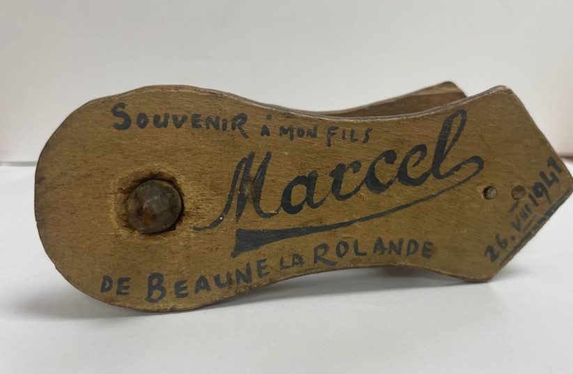  A Purim noisemaker, handmade by Kelman Micenmacher for his son Marcel in Nazi-occupied France in 1941. The grogger is now in the collection of Yad Vashem. (credit: YAD VASHEM)