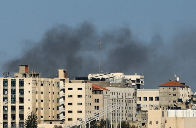  Smoke rises during an Israeli raid at Al Shifa hospital and the area around it, amid the ongoing conflict between Israel and the Palestinian Islamist group Hamas, in Gaza City, March 21, 2024.  (credit:  REUTERS/Dawoud Abu Alkas/File Photo)