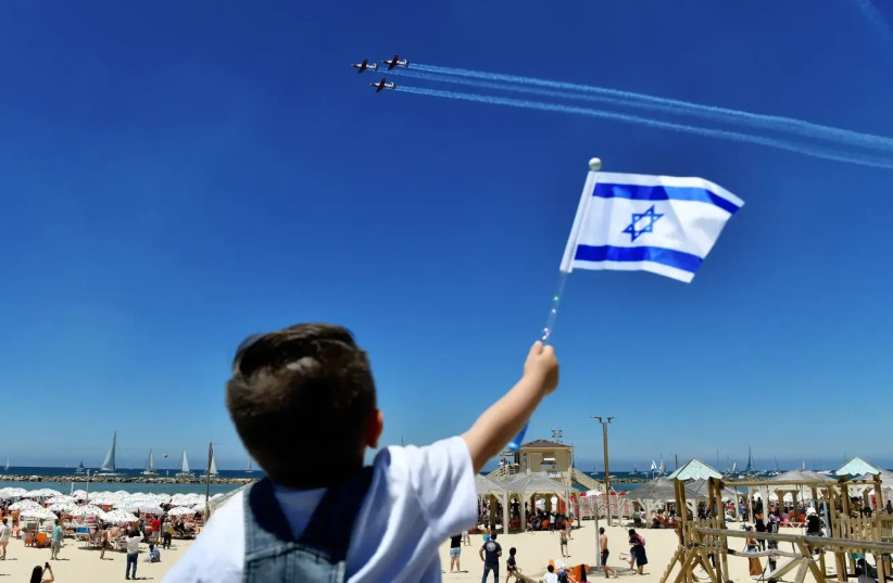   Israel Air Force planes are seen flying on Independence Day, Tel Aviv beach, April 26, 2023 (credit: REUVEN CASTRO)
