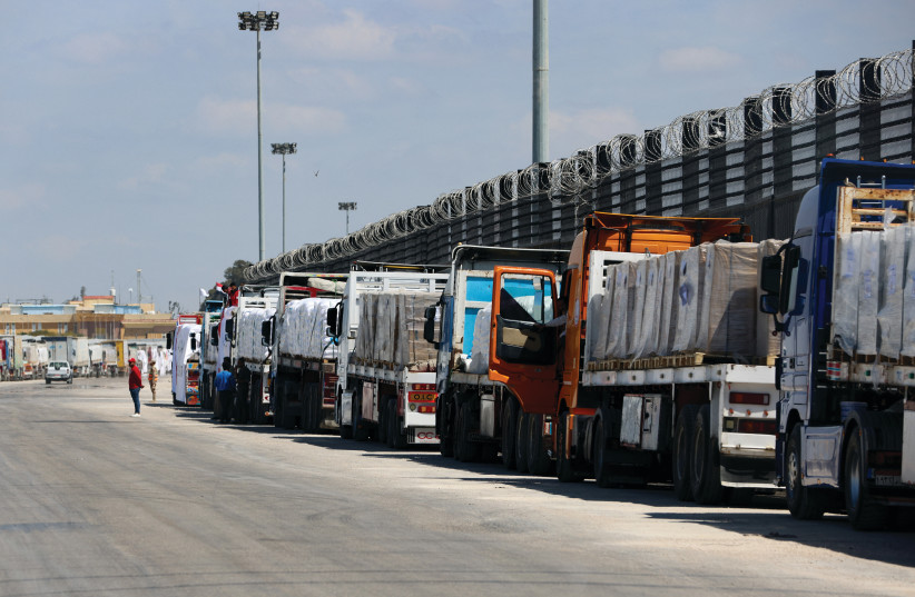  TRUCKS LINE UP near the Rafah border crossing on Saturday. It cannot be denied that the absence of an effective administrative mechanism to manage the distribution of humanitarian aid is strongly felt, says the writer. (credit: MOHAMED ABD EL GHANY/REUTERS)