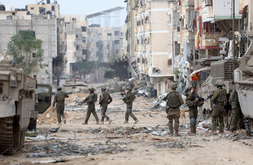  Israel's military patrols near Al Shifa Hospital compound in Gaza City, amid the ongoing ground operation of the Israeli army against Palestinian Islamist group Hamas, in the northern Gaza Strip, November 22, 2023. (credit: REUTERS/Ronen Zvulun)