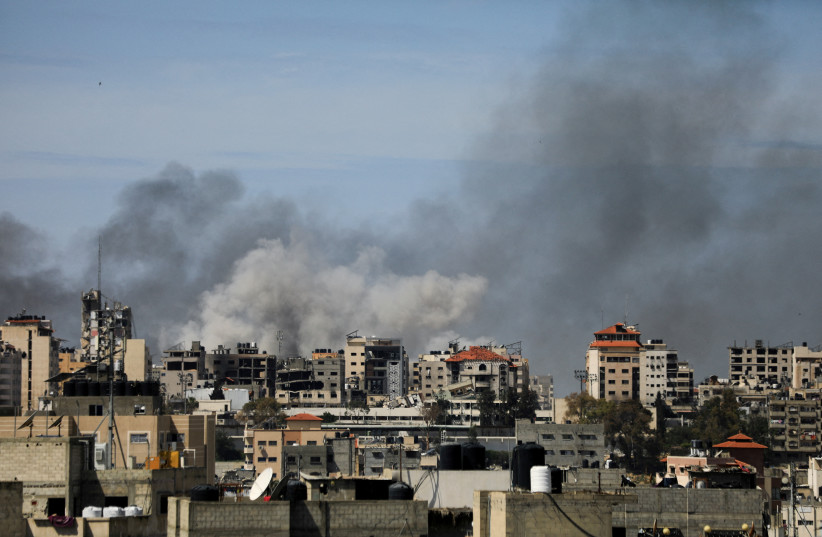 Smoke rises during an Israeli raid at Al Shifa hospital and the area around it, amid the ongoing conflict between Israel and the Palestinian Islamist group Hamas, in Gaza City, March 21, 2024. (credit:  REUTERS/Dawoud Abu Alkas/File Photo)