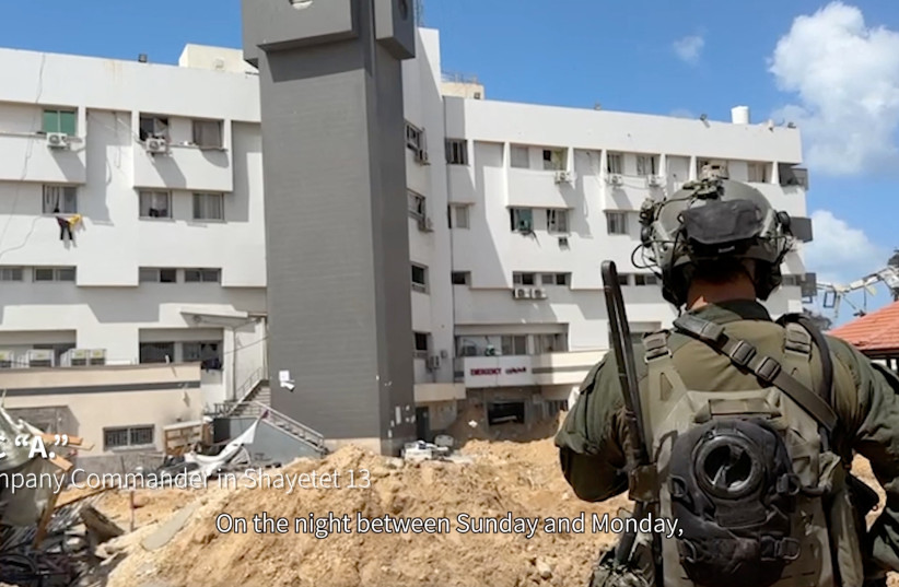  An Israeli soldier stands near al-Shifa hospital, where the Israeli army says weapons were found, in Gaza City, in this still image taken from video released on March 25, 2024.  (credit: Israel Defense Forces/Handout via REUTERS)