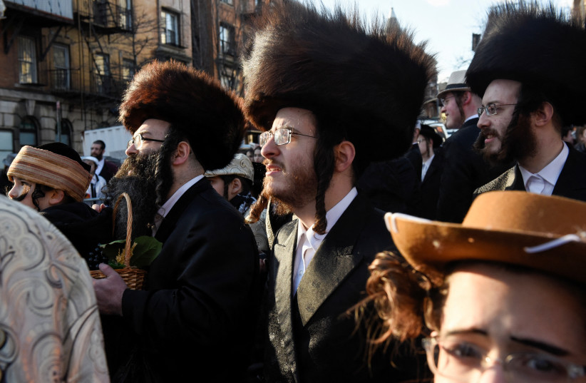  People gather for celebrations to mark the Jewish holiday of Purim, in the Brooklyn borough of New York City, U.S., March 7, 2023.  (credit: STEPHANIE KEITH/REUTERS)