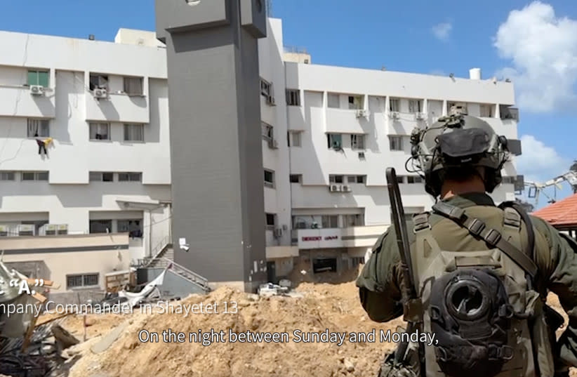   Un soldado israelí cerca del hospital al-Shifa, donde el ejército israelí afirma que se encontraron armas, en la ciudad de Gaza, en esta imagen tomada de un vídeo difundido el 25 de marzo de 2024. (credit: Israel Defense Forces/Handout via REUTERS)