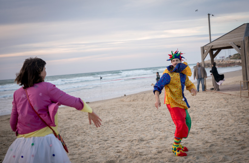  People dressed up in costumes attend a dance party by the beach in Tel Aviv, during the Jewish holiday of Purim. March 23, 2024. (credit: MIRIAM ALSTER/FLASH90)