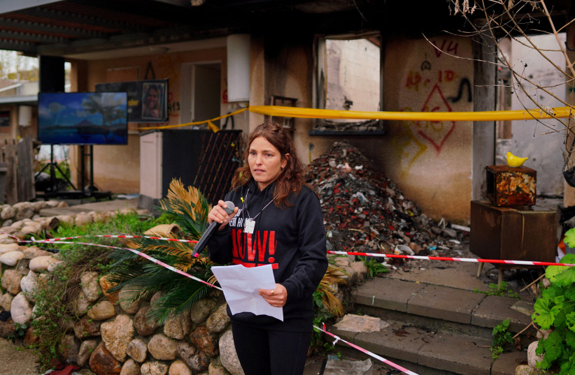  Released hostage Amit Soussana, kidnapped on the deadly October 7 attack by Palestinian Islamist group Hamas, talks to the press in front of her destroyed home at the Kibbutz Kfar Aza, Israel, January 29, 2024 (credit: REUTERS/ALEXANDRE MENEGHINI)
