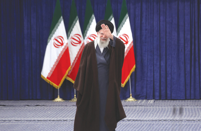 IRAN’S SUPREME Leader Ayatollah Ali Khamenei gestures after he votes during parliamentary elections in Tehran, earlier this month. Iran, like all dictatorial regimes, will one day fall and we in the free world have a duty to accelerate this process, says the writer.