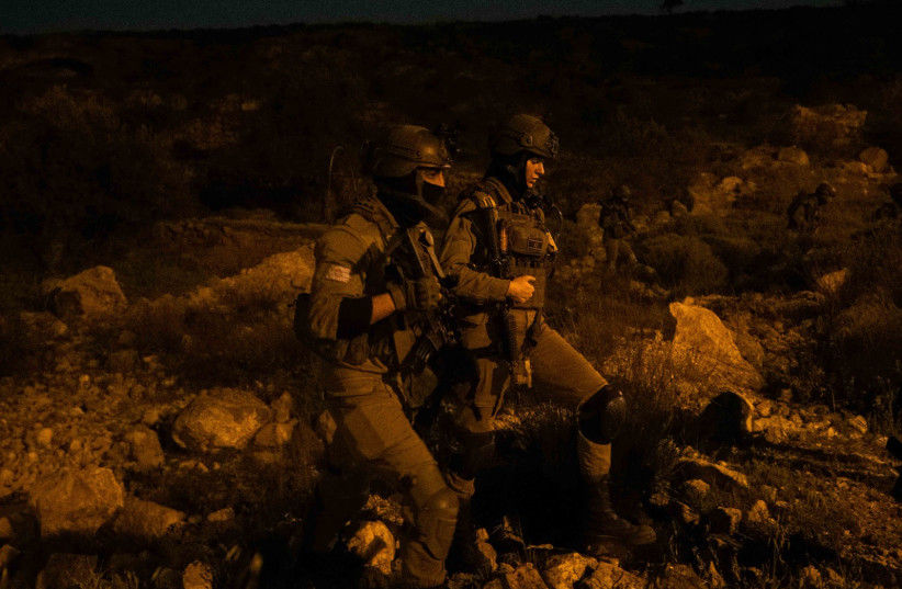IDF soldiers operate overnight in the West Bank, March 27, 2024.