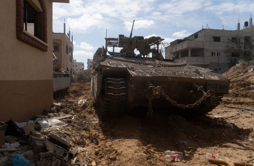  An Israeli tank is seen in Khan Yunis, southern Gaza, on March 27, 2024 (credit: IDF SPOKESPERSON'S UNIT)