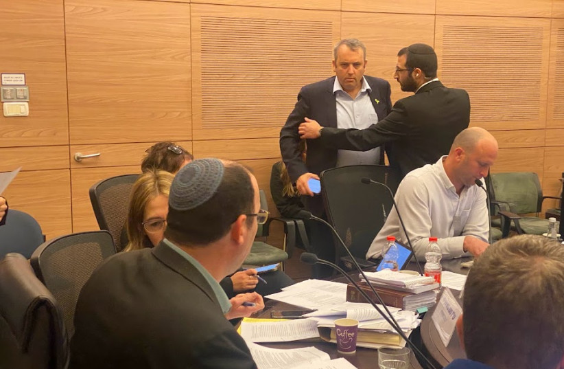  Mk Gilad Kariv being ejected from the Knesset Constitutional Committee meeting after causing a commotion, March 27, 2024. (credit: DANI SHEM TOV/KNESSET SPOKESPERSONS OFFICE)