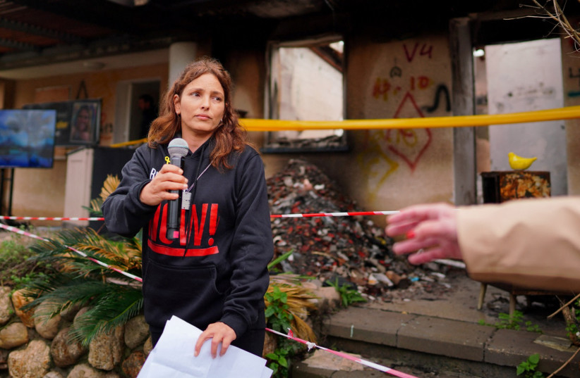  Released hostage Amit Soussana, kidnapped on the deadly October 7 attack by Palestinian Islamist group Hamas, talks to the press in front of her destroyed home at the Kibbutz Kfar Aza, Israel, January 29, 202 (credit: REUTERS/ALEXANDRE MENEGHINI)