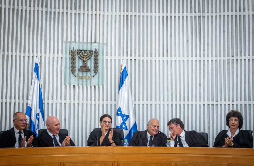  Former Supreme Court chief justice Esther Hayut (C) with former Supreme Court judge George Karra (to her L) and Supreme Court justices at an outgoing ceremony held for Karra, 2022 (credit: YONATAN SINDEL/FLASH90)