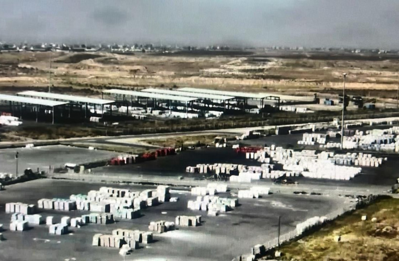  A photo shared by Israel's Coordinated Office of Government Activity in the Territories (COGAT), purporting to show humanitarian aid piled up, undistributed, on the Gazan side of the Kerem Shalom crossing. (credit: COGAT VIA X)
